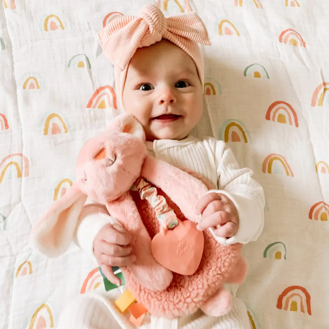 Baby Girl Holding Pink Ana Bunny